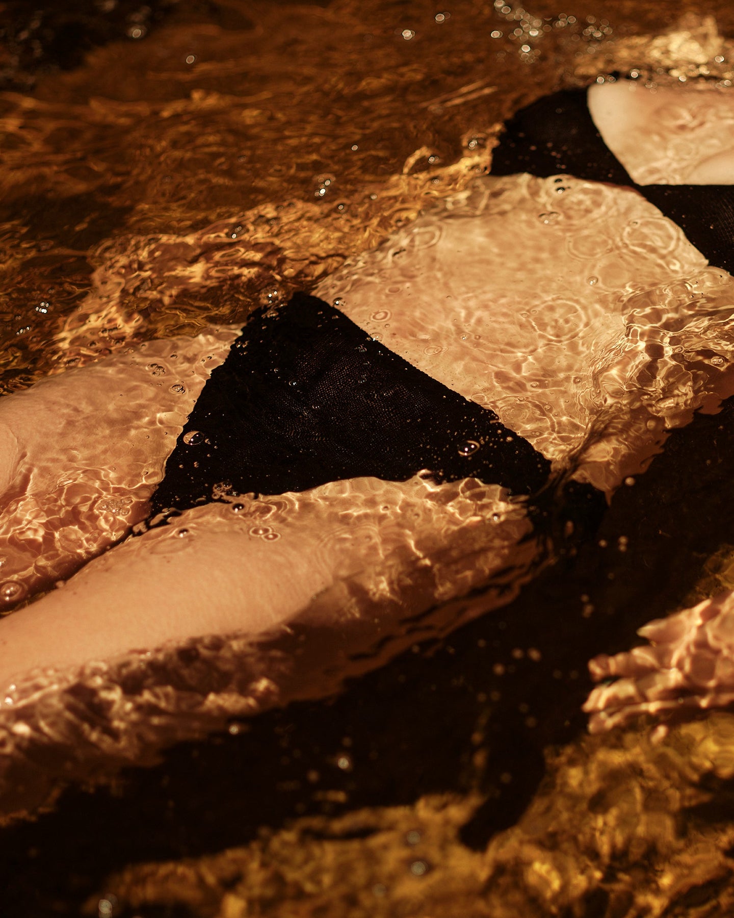 knit swim brief front in water on body 