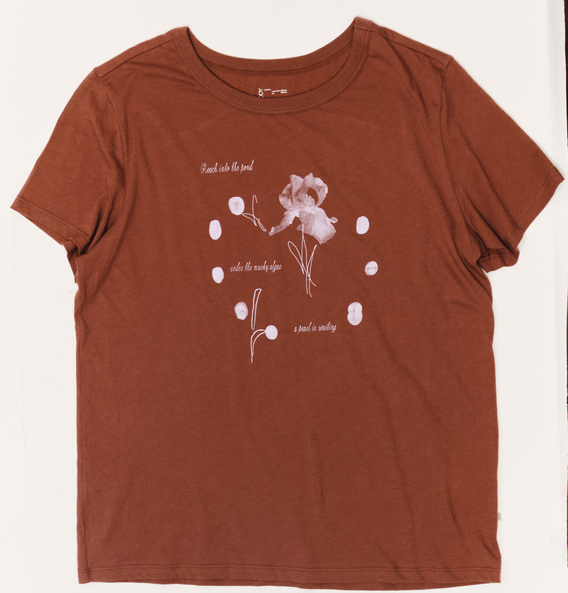 Brown t-shirt with floral design and text on a white background