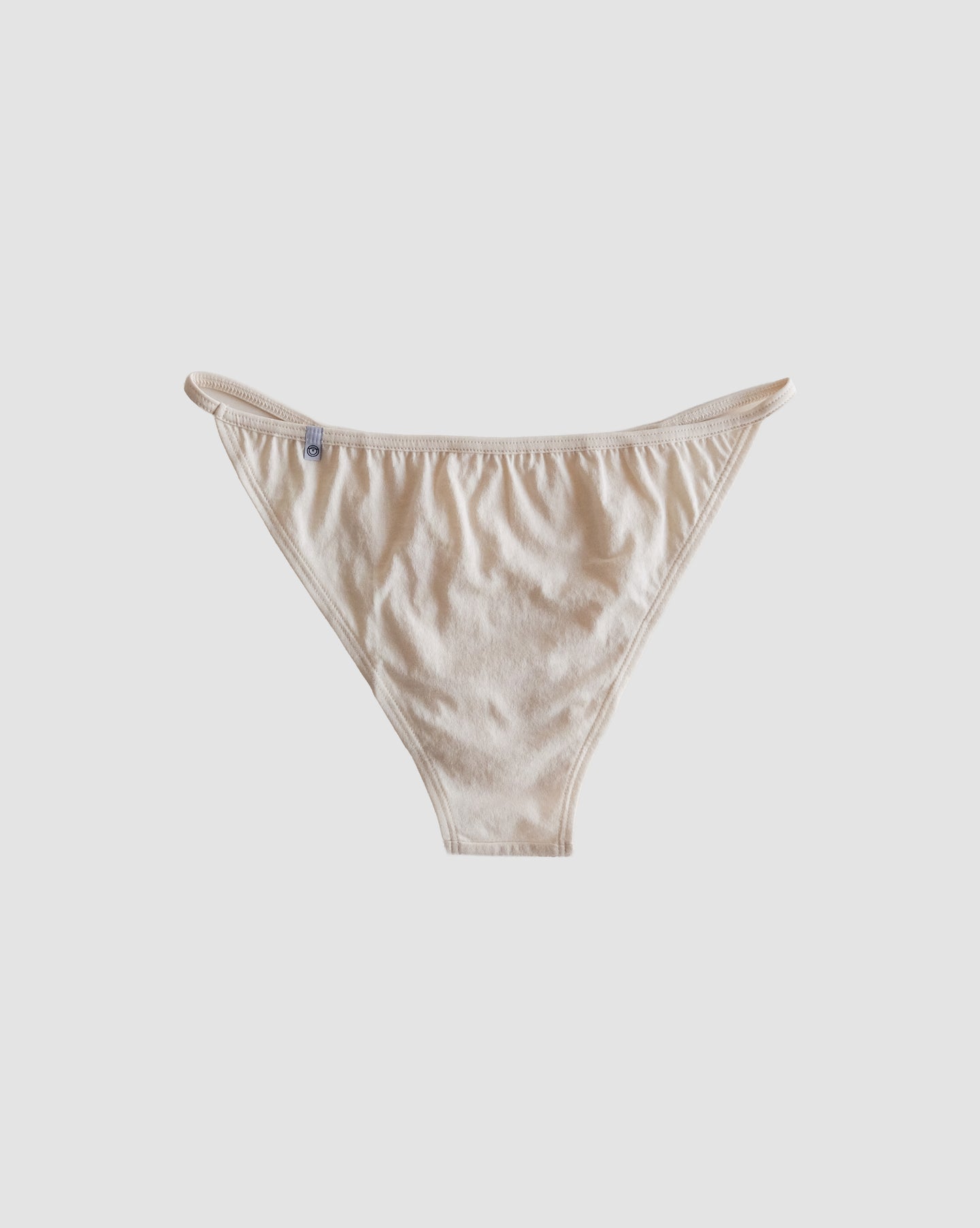 back of string bikini in greige