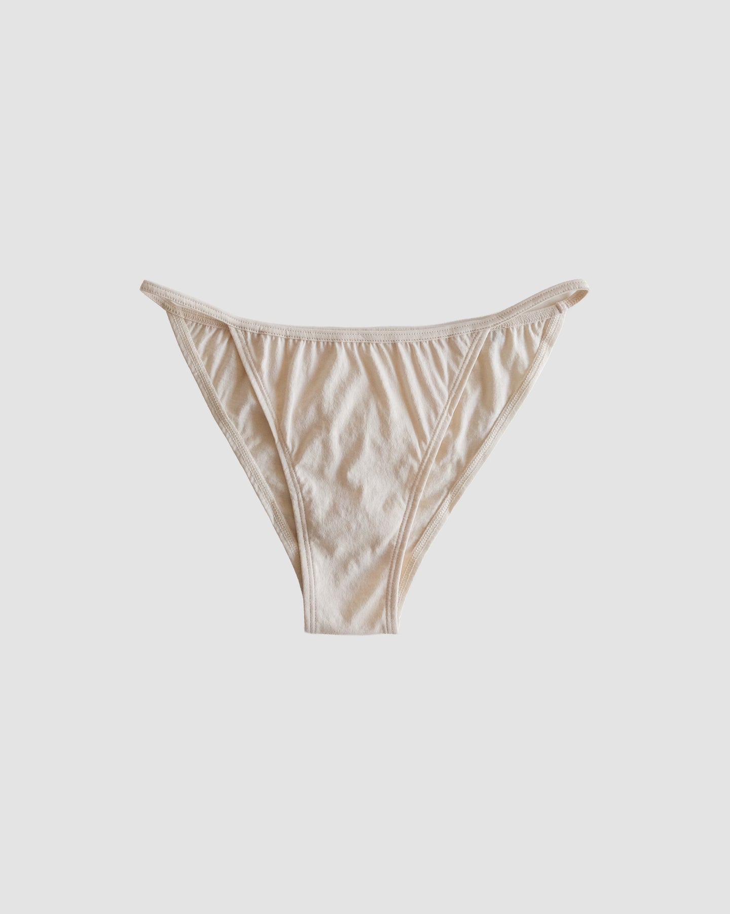 front of string bikini in greige